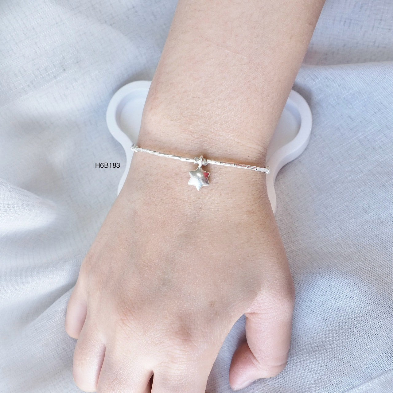 Traditional Thai techniques meet modern style in this silver bracelet.