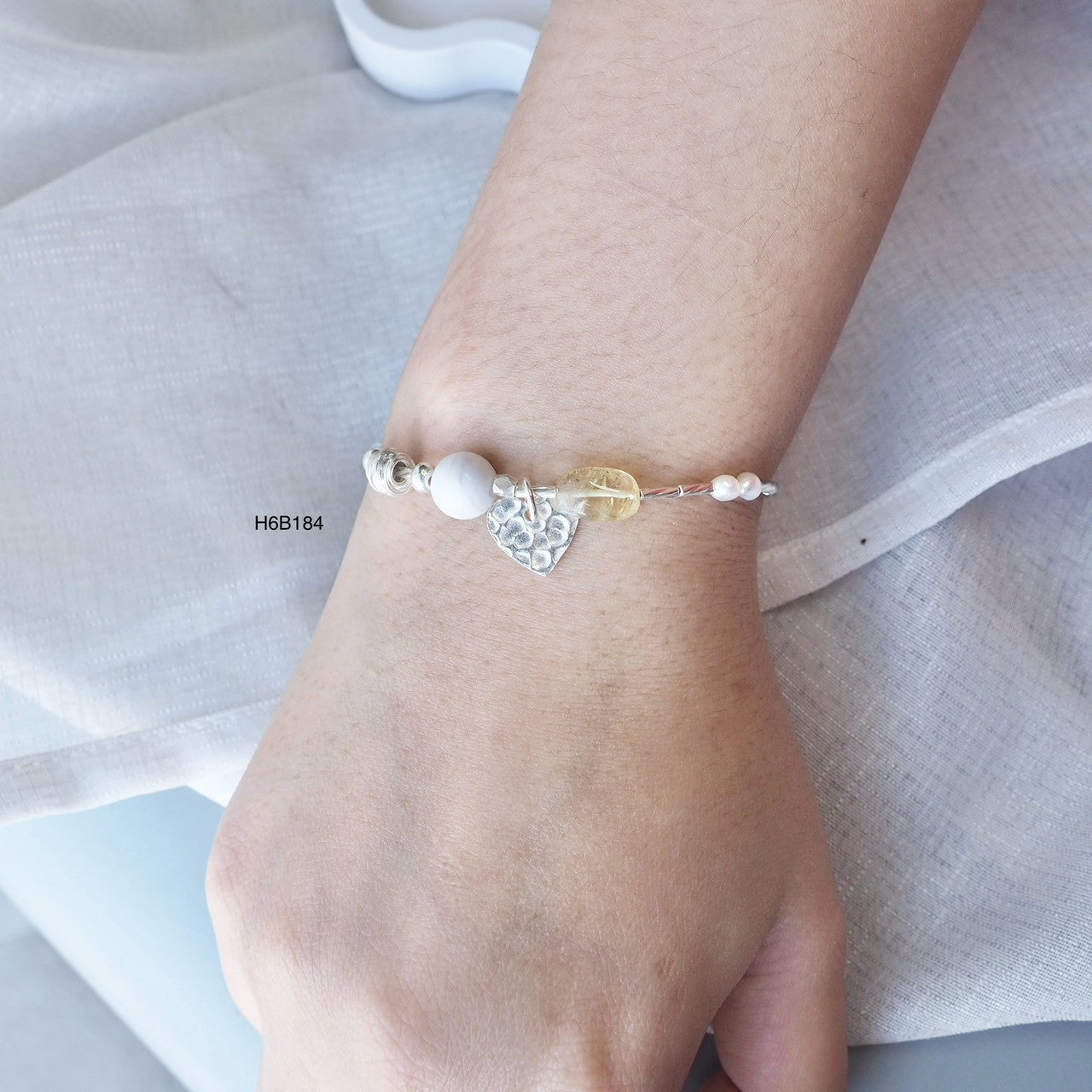 Feel the premium quality of a 98% pure silver bracelet.