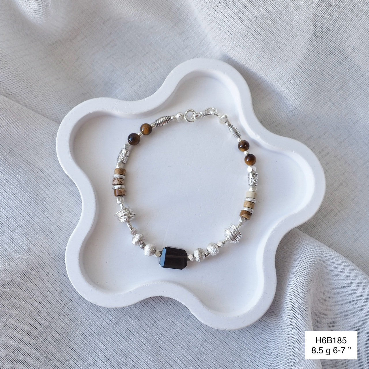 Intricate details, handmade charm. Love this Thai silver bracelet.