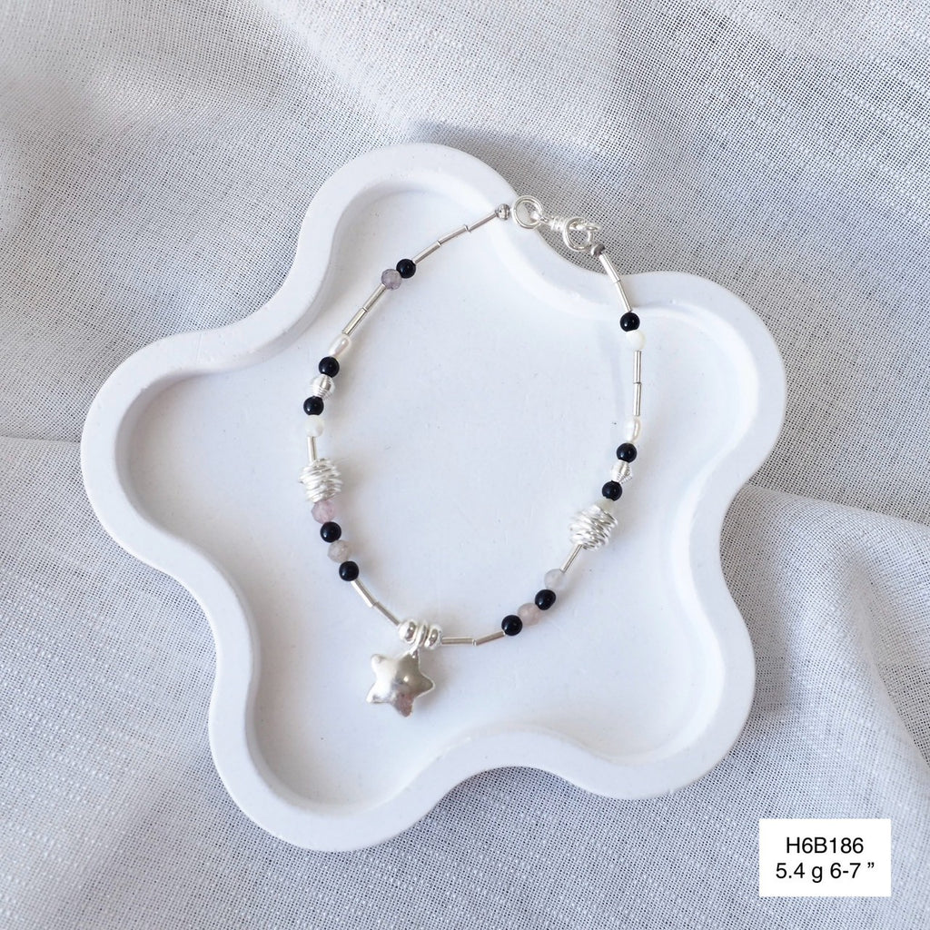 Bring a piece of Thailand home with this silver bracelet.