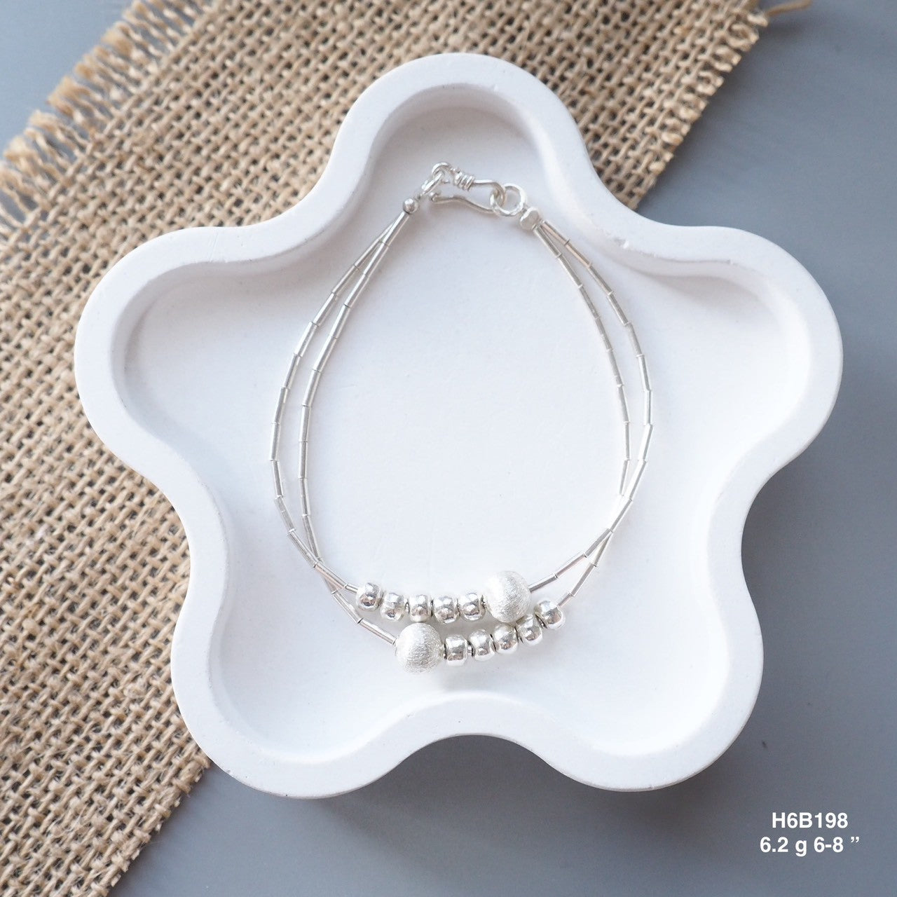 Go minimalist with a sleek, 98% pure Thai silver bracelet.