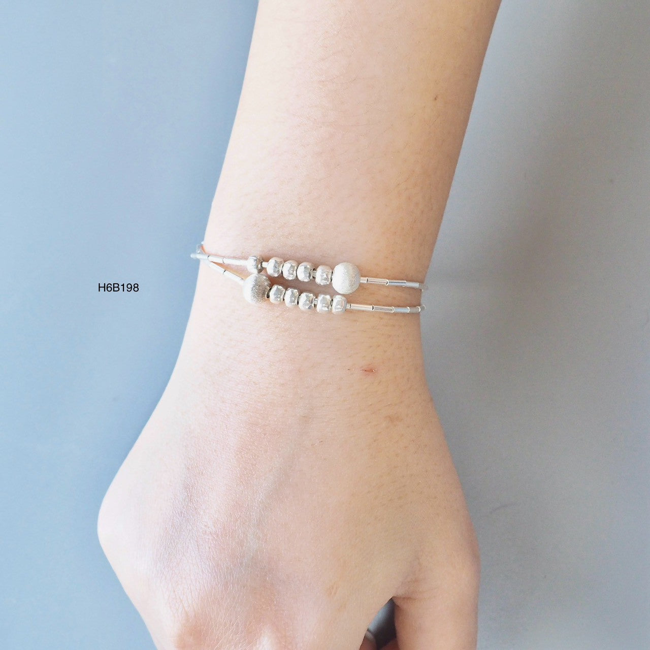 Go minimalist with a sleek, 98% pure Thai silver bracelet.