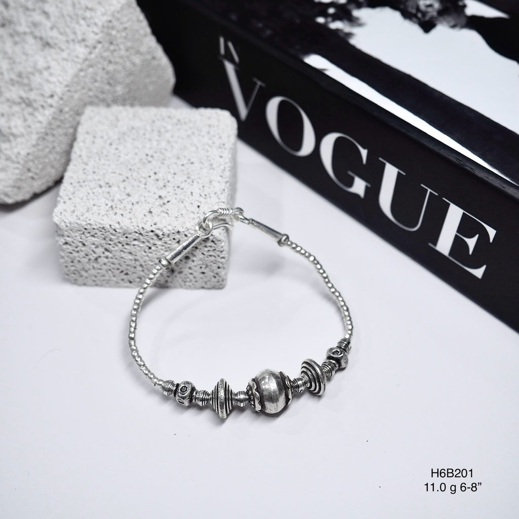 Match any outfit with this versatile, handmade silver bracelet.