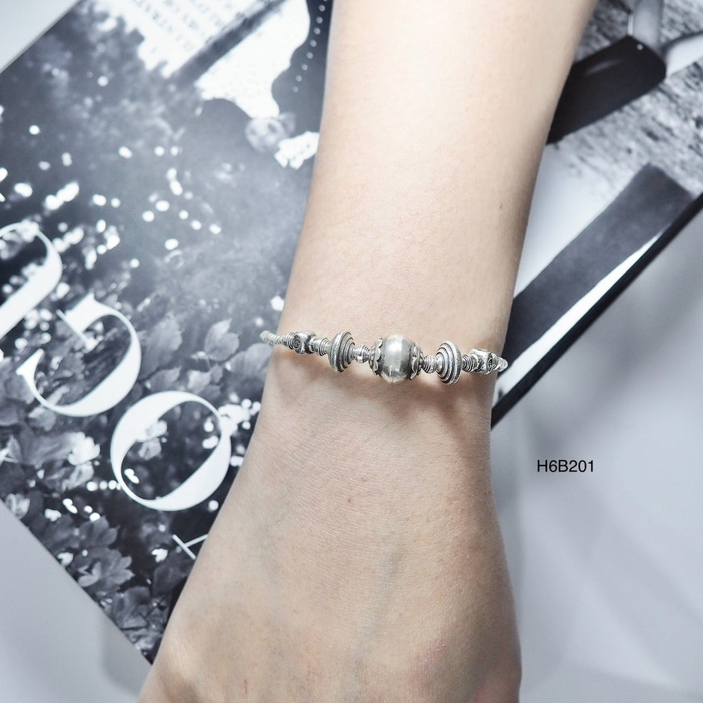 Match any outfit with this versatile, handmade silver bracelet.