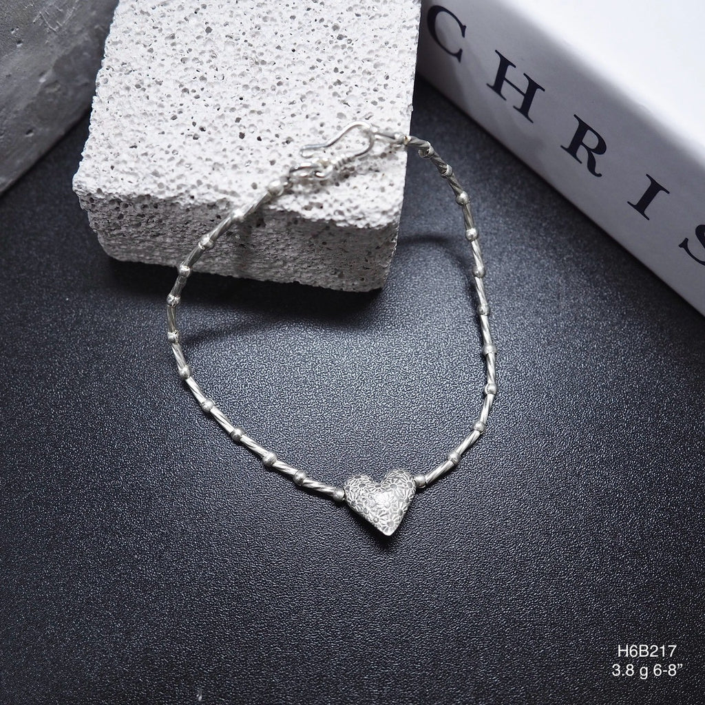 Detailed by hand, inspired by Thailand. Rock this silver bracelet.