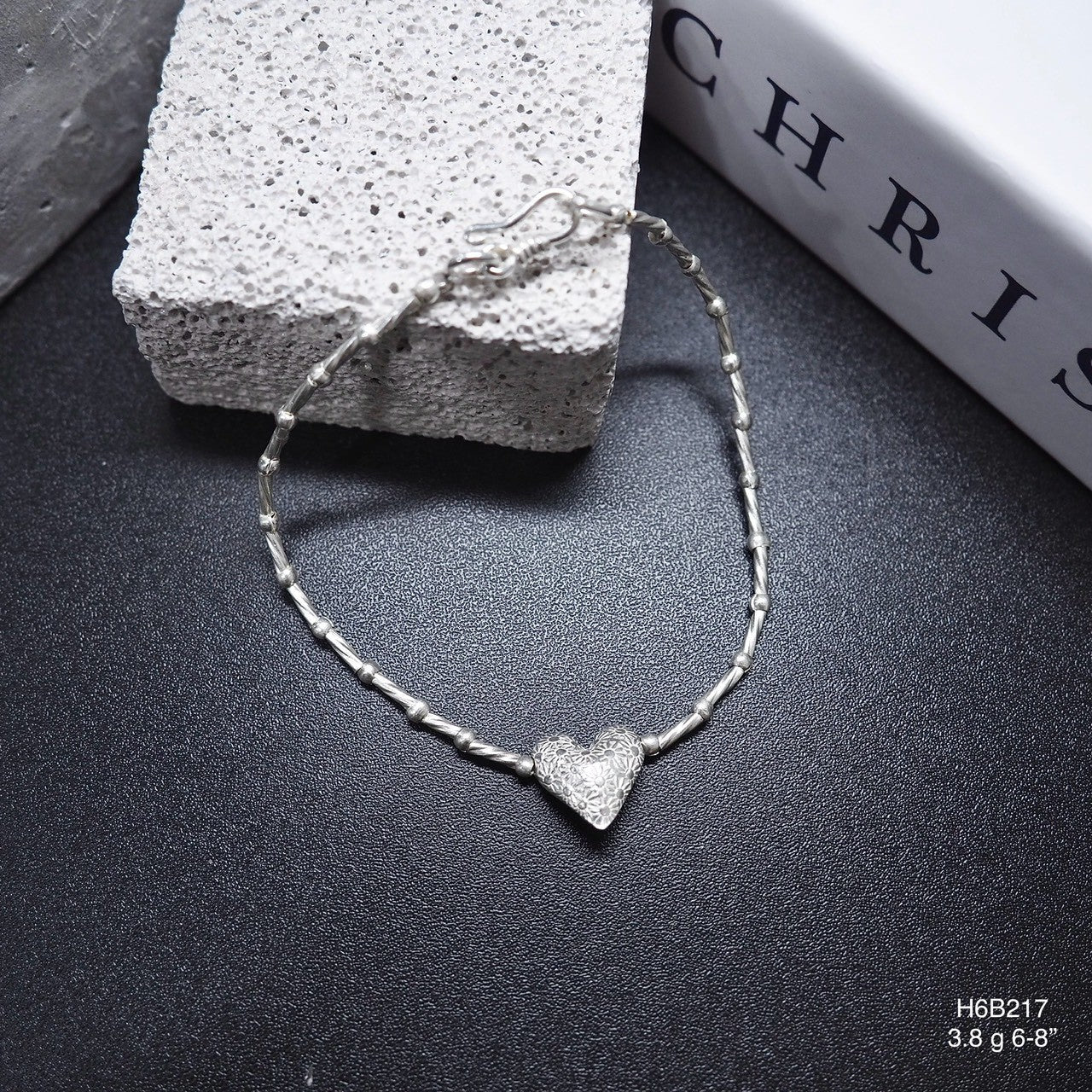 Detailed by hand, inspired by Thailand. Rock this silver bracelet.