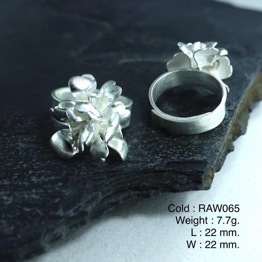 Hand-finished floral silver ring.