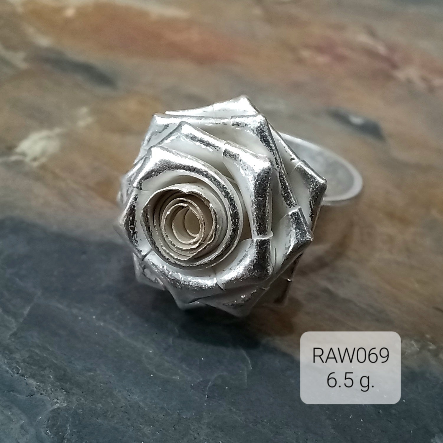 Delicate bloom, strong silver ring.
