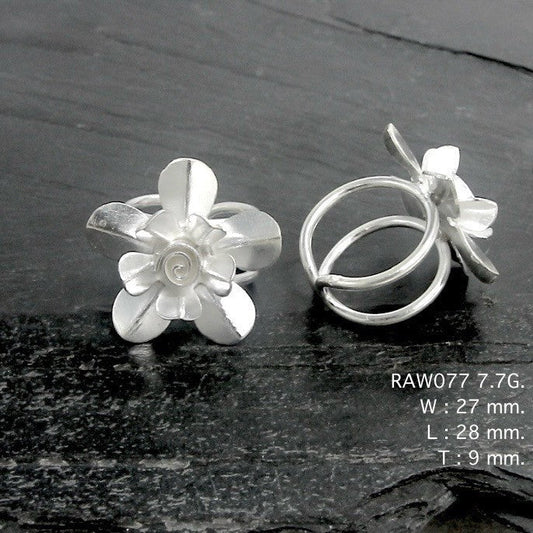 Delicate details on a unique silver ring.