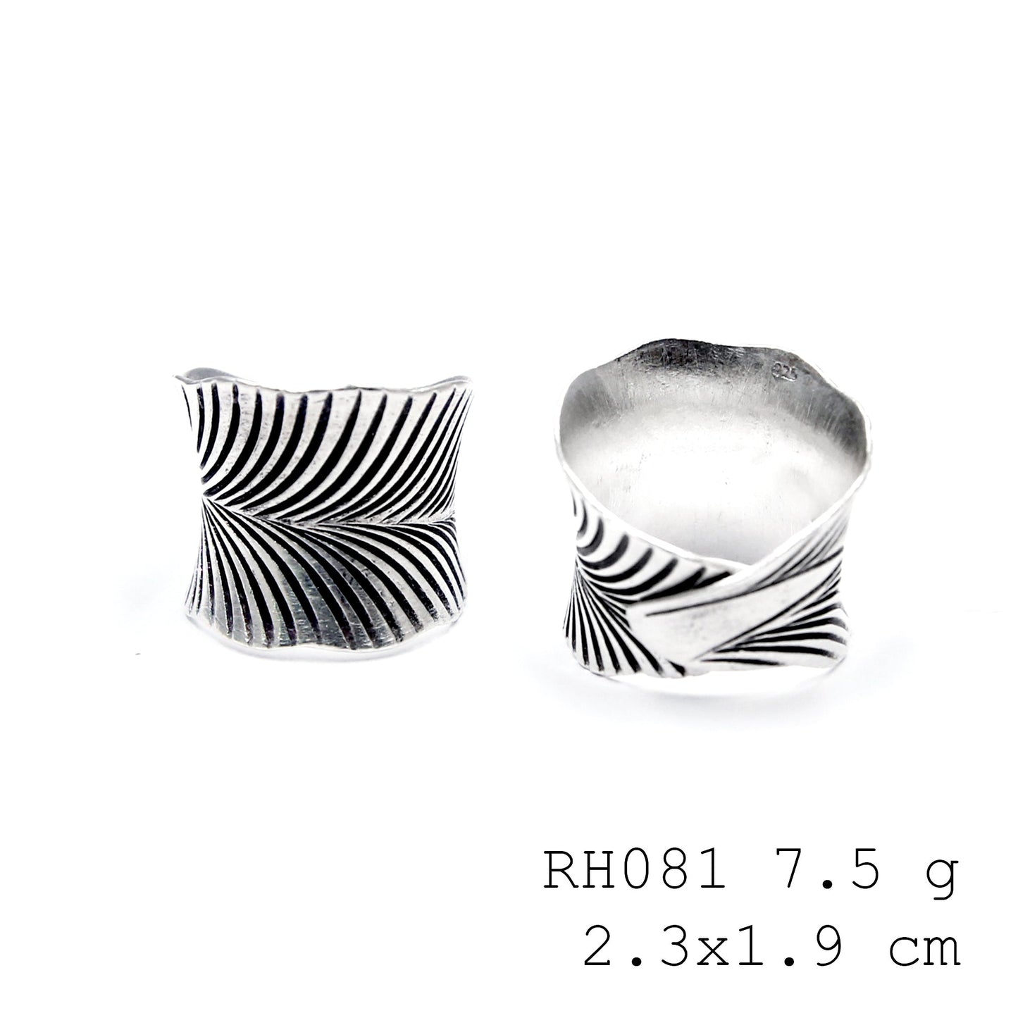 A whispering leaf captured in a silver ring.