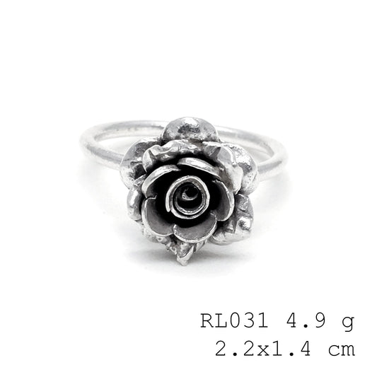 A whimsical touch with a handmade silver ring.