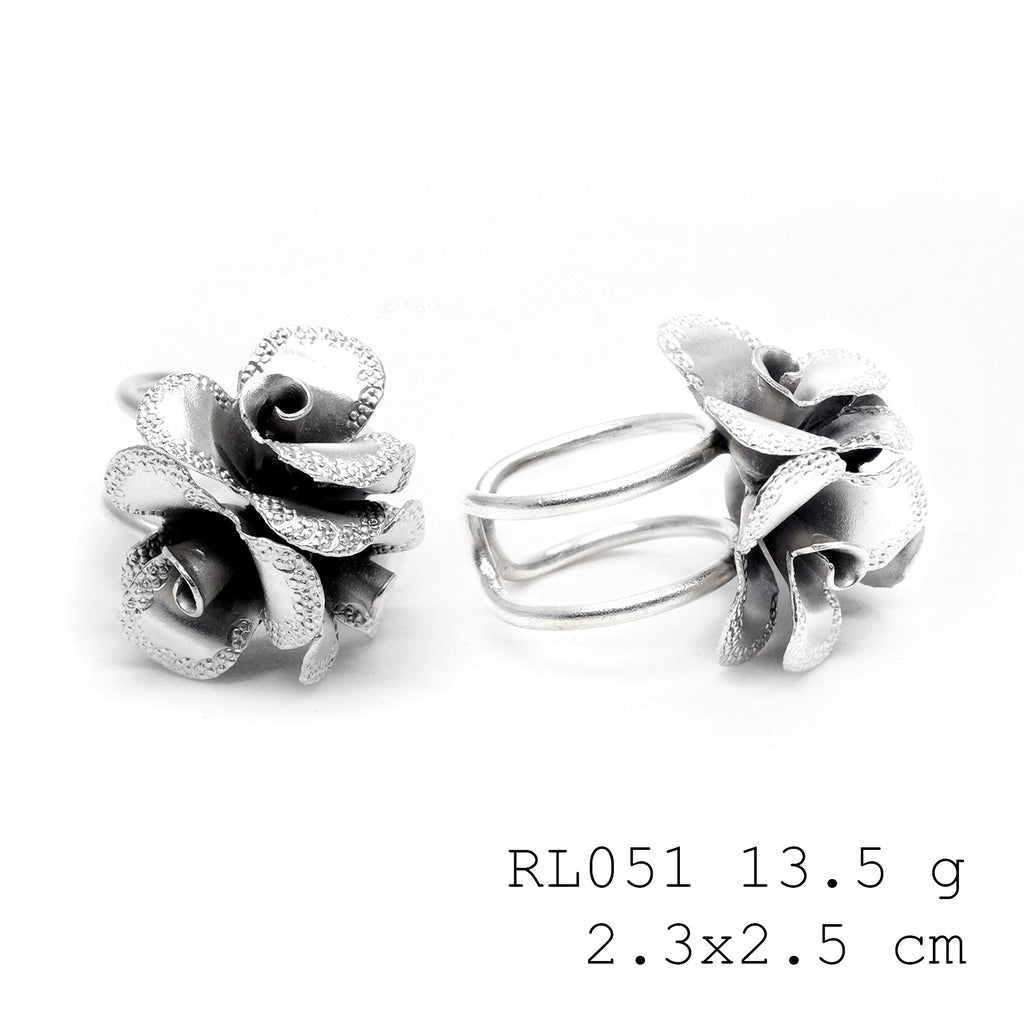 Wearable art in the form of a silver ring.