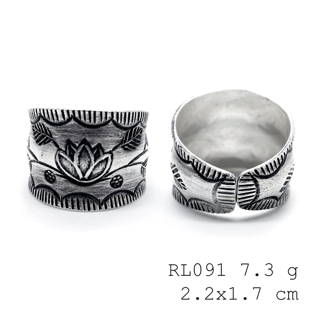 One-of-a-kind petals on a pure silver ring.