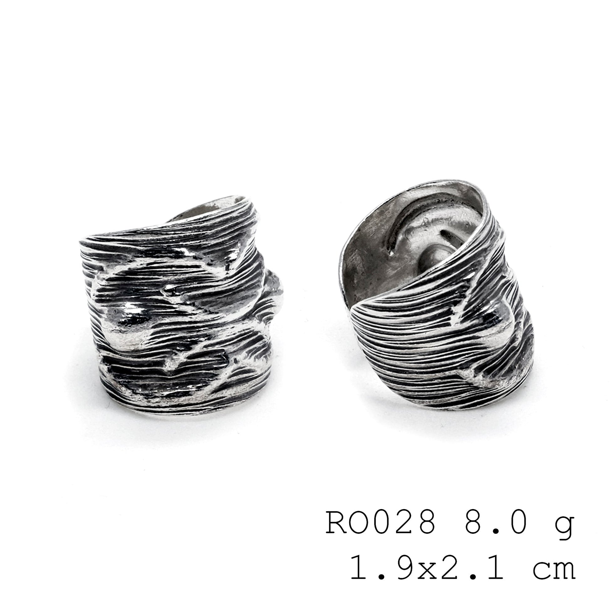 Uniquely yours, this hand-carved silver ring.