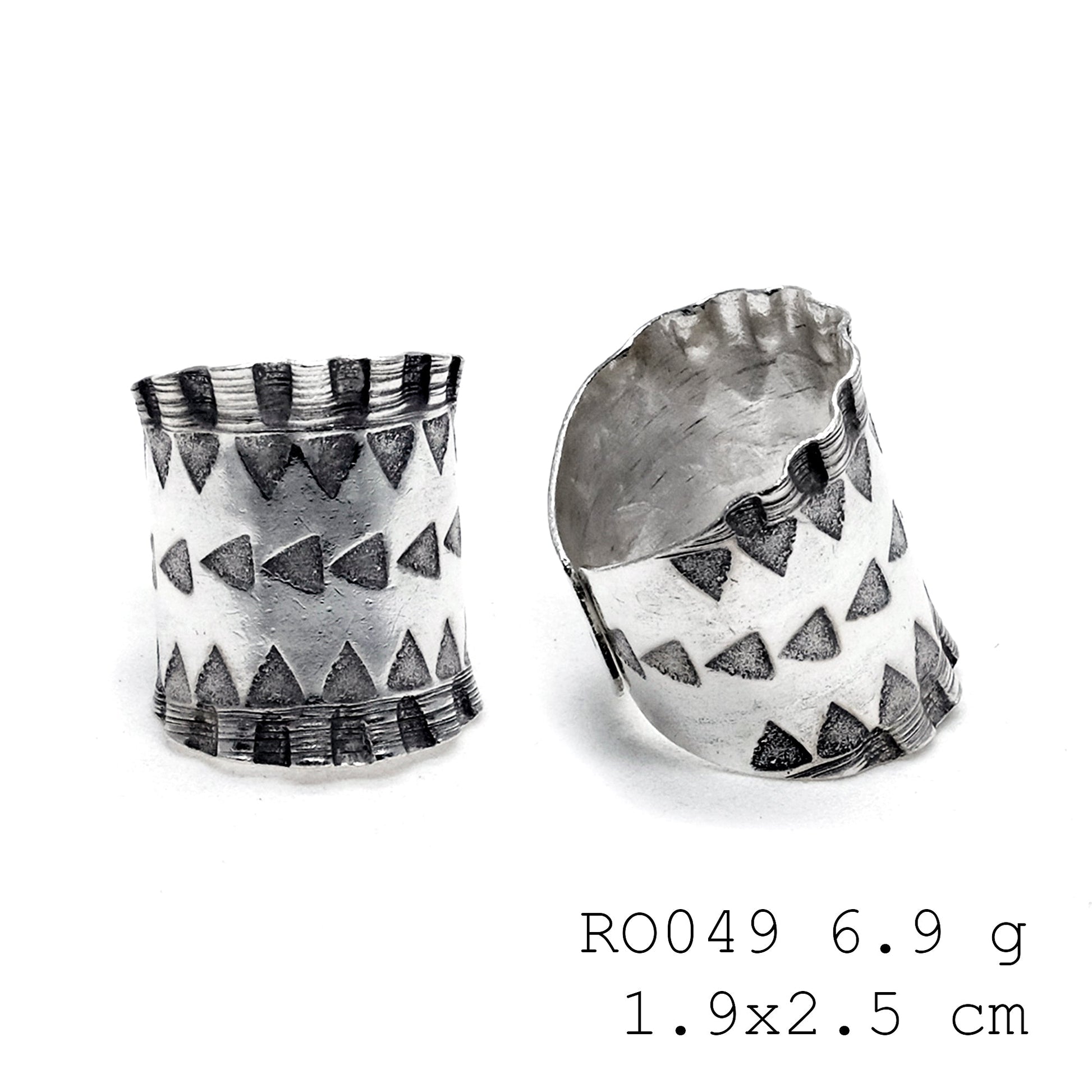 Sleek, silver, and hand-carved silver ring.