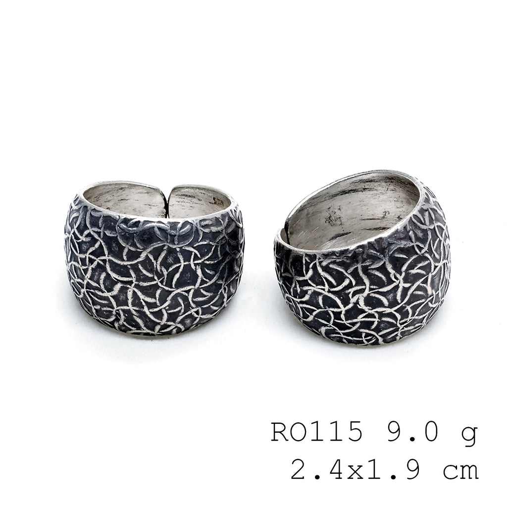 Carved by hand, worn with pride: a silver ring.