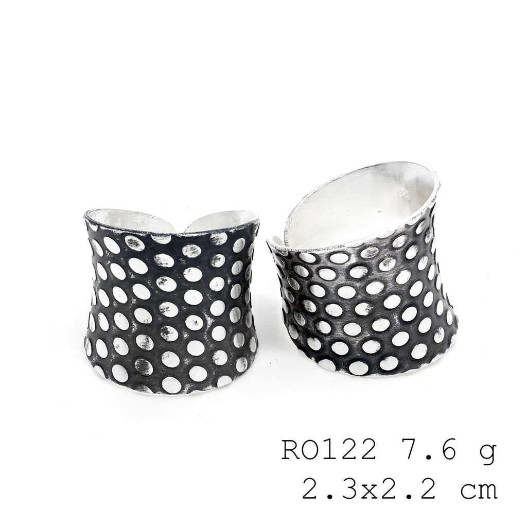 Sculpted by hand, this silver ring.