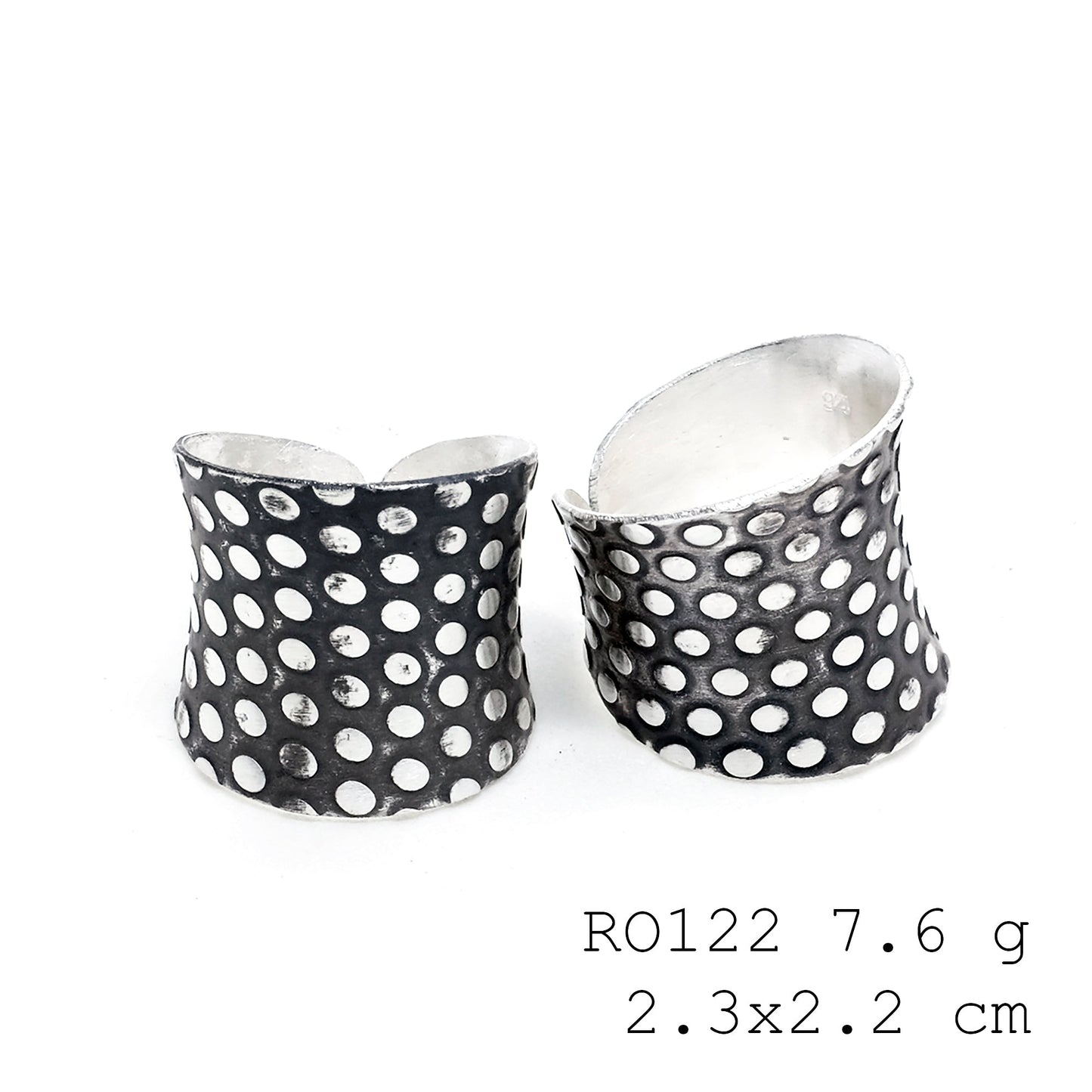 Sculpted by hand, this silver ring.