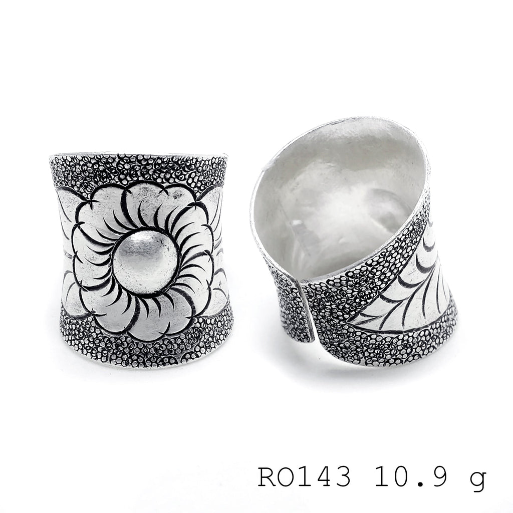 Hand-sculpted details on a pure silver ring.