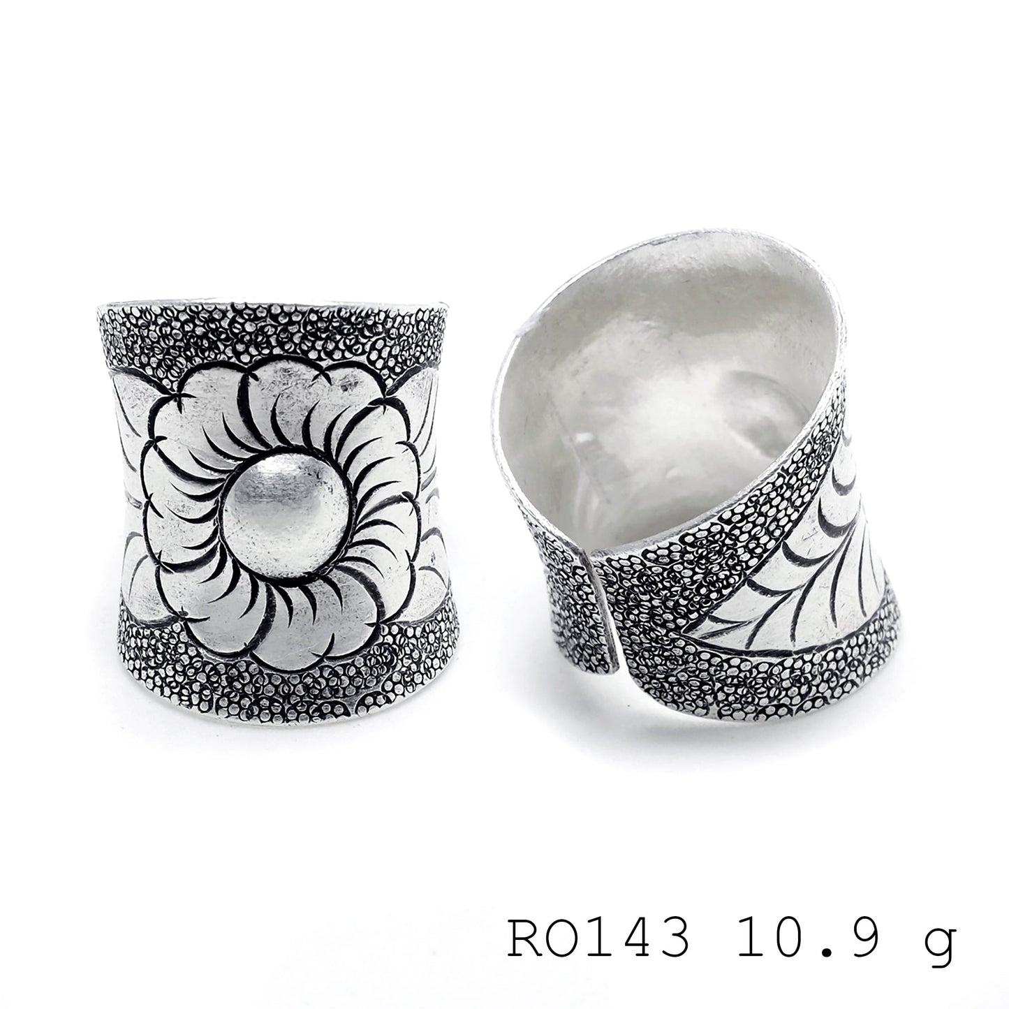 Hand-sculpted details on a pure silver ring.