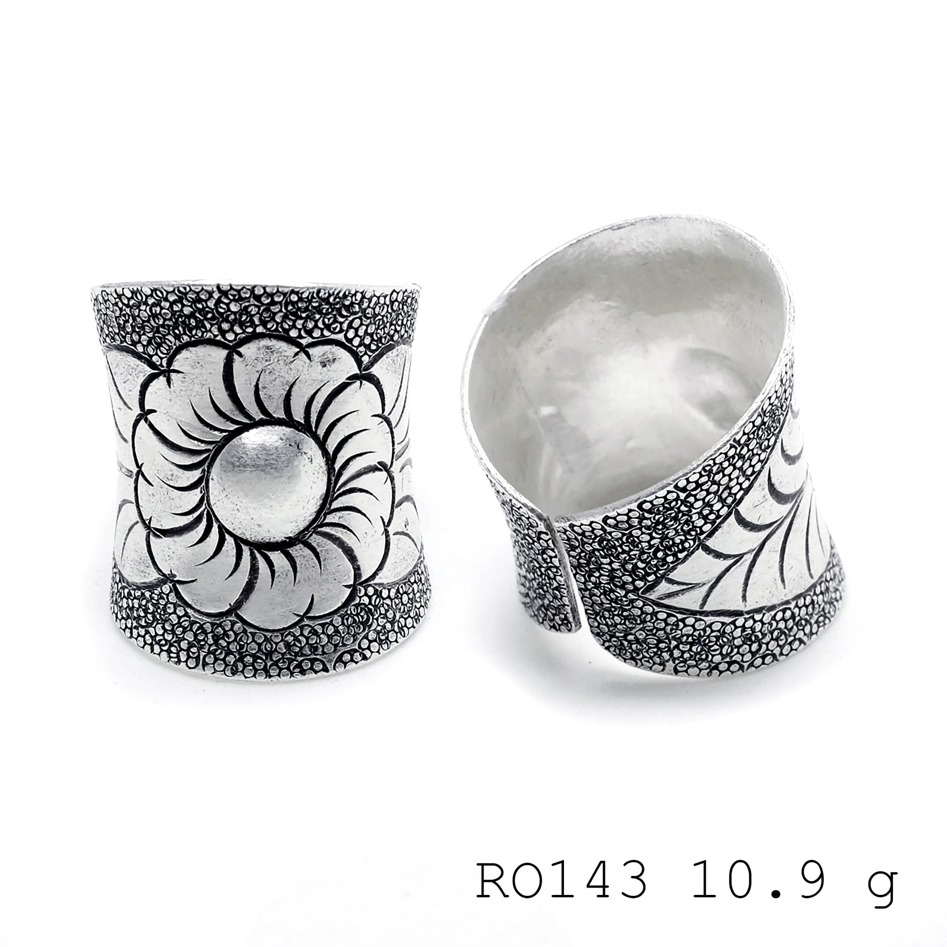 Hand-sculpted details on a pure silver ring.