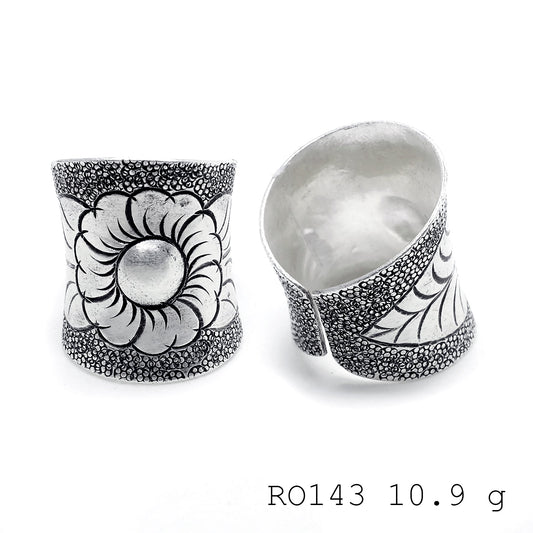 Hand-sculpted details on a pure silver ring.