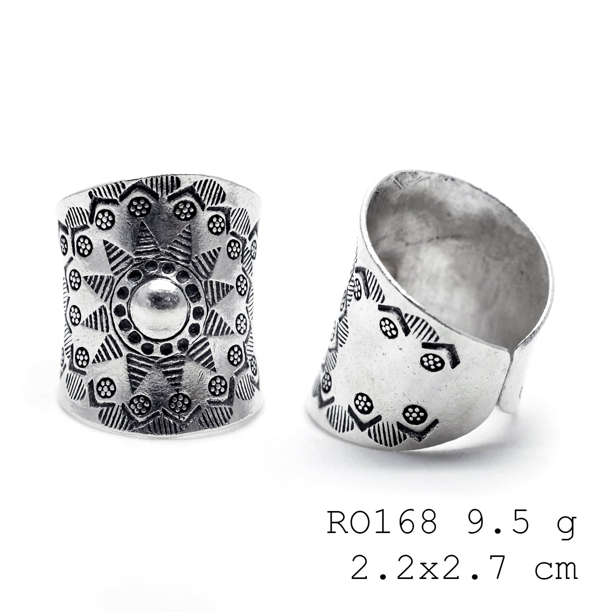 Petals and patterns on a silver ring.