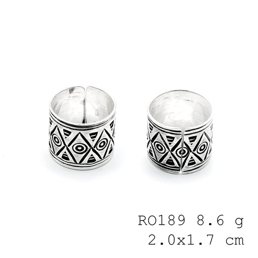 Carved in moonlight, this silver ring.