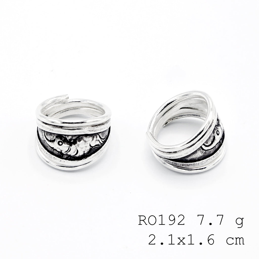 Modern carving on a classic silver ring.