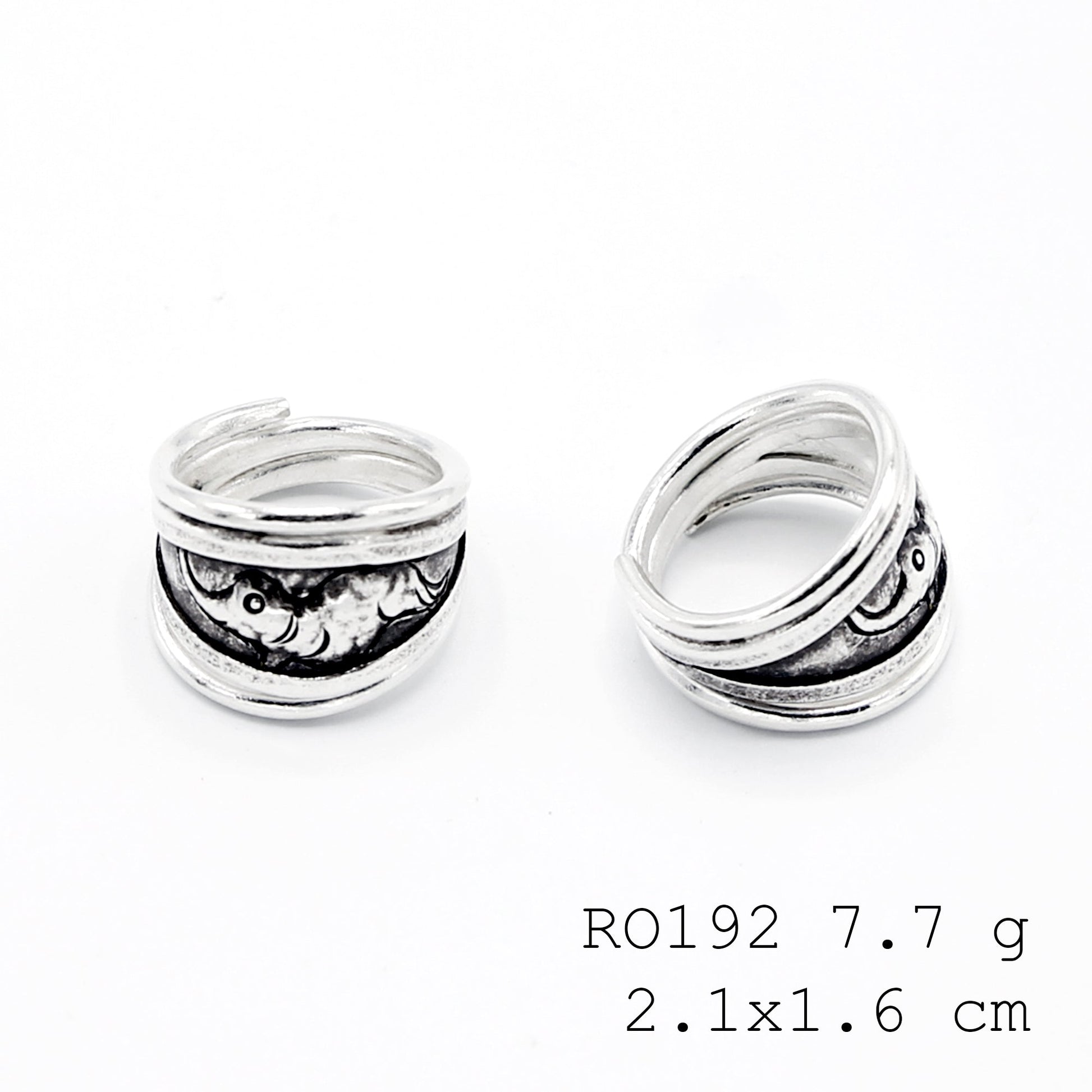 Modern carving on a classic silver ring.