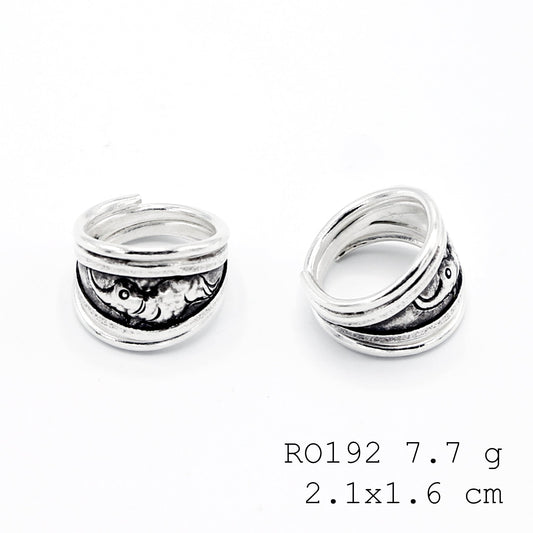 Modern carving on a classic silver ring.