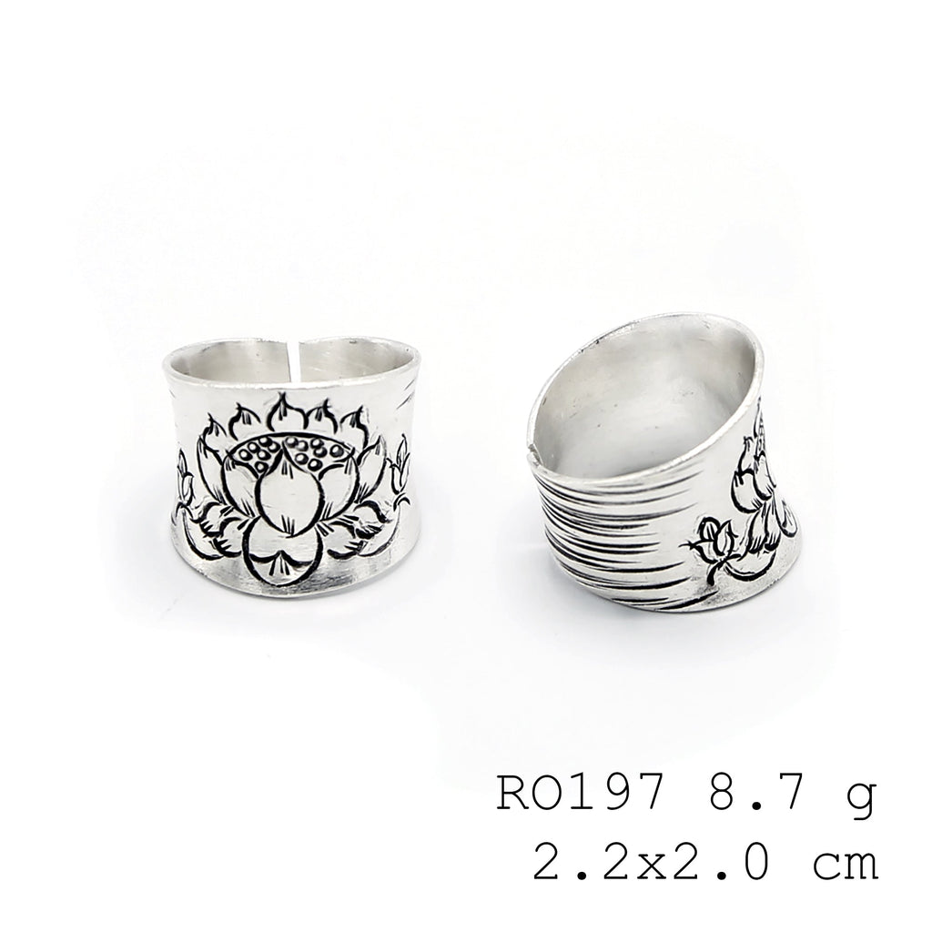 The centerpiece of your hand: a silver ring.