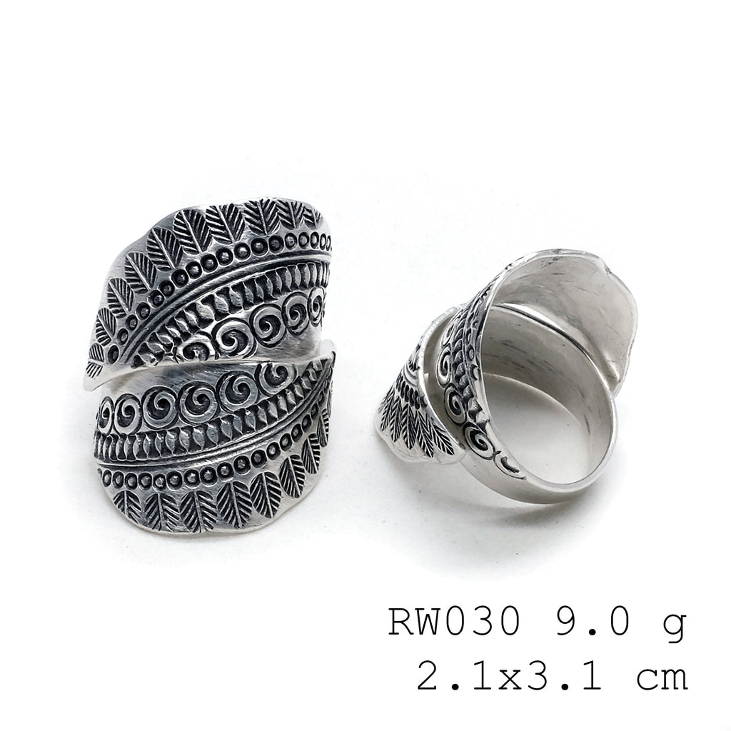 The silver cross. A handmade silver ring.