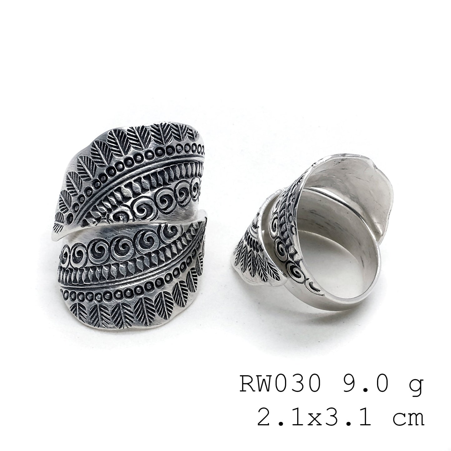 The silver cross. A handmade silver ring.