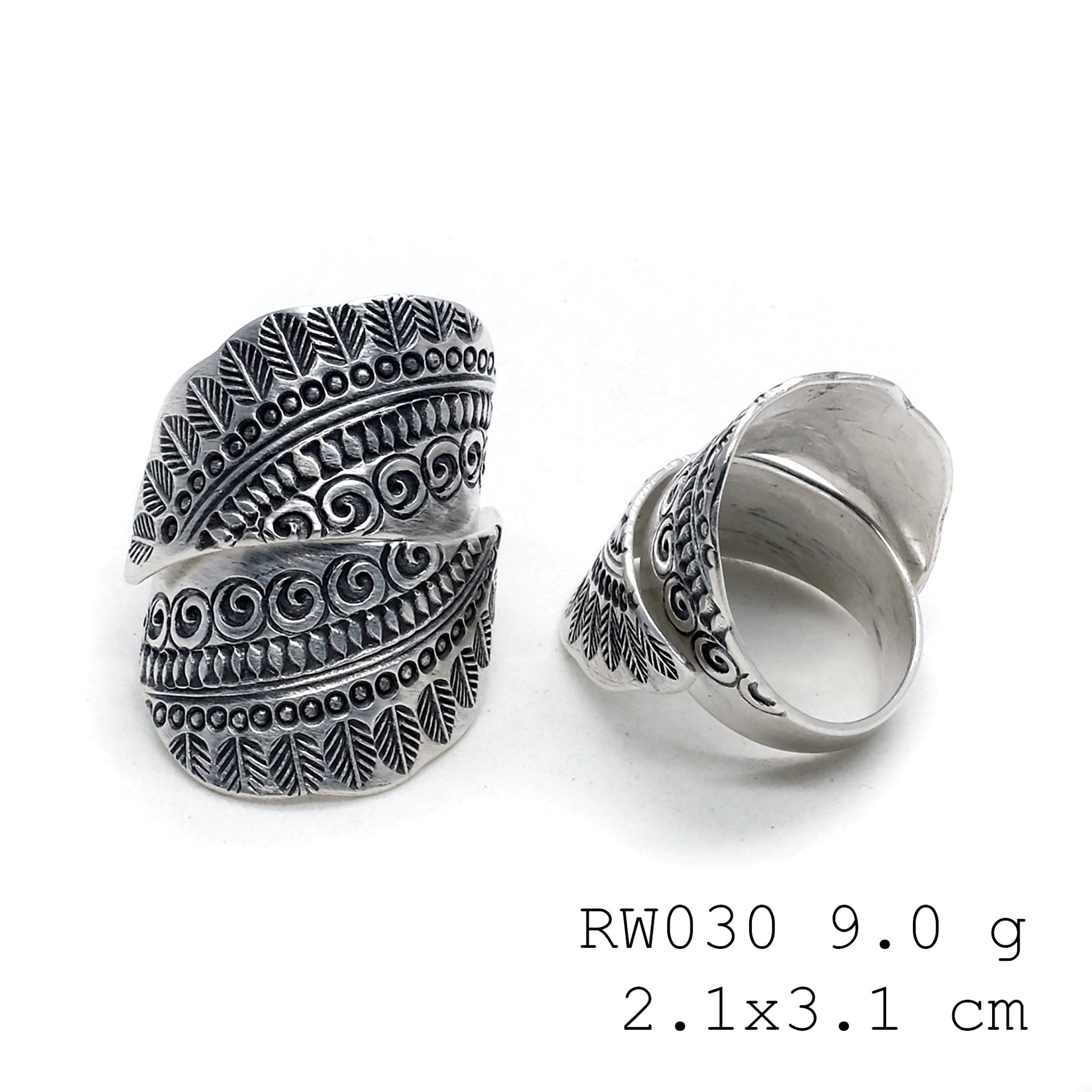 The silver cross. A handmade silver ring.