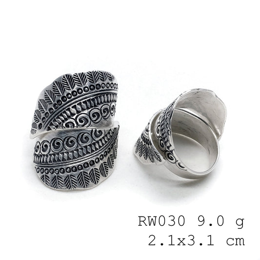 The silver cross. A handmade silver ring.