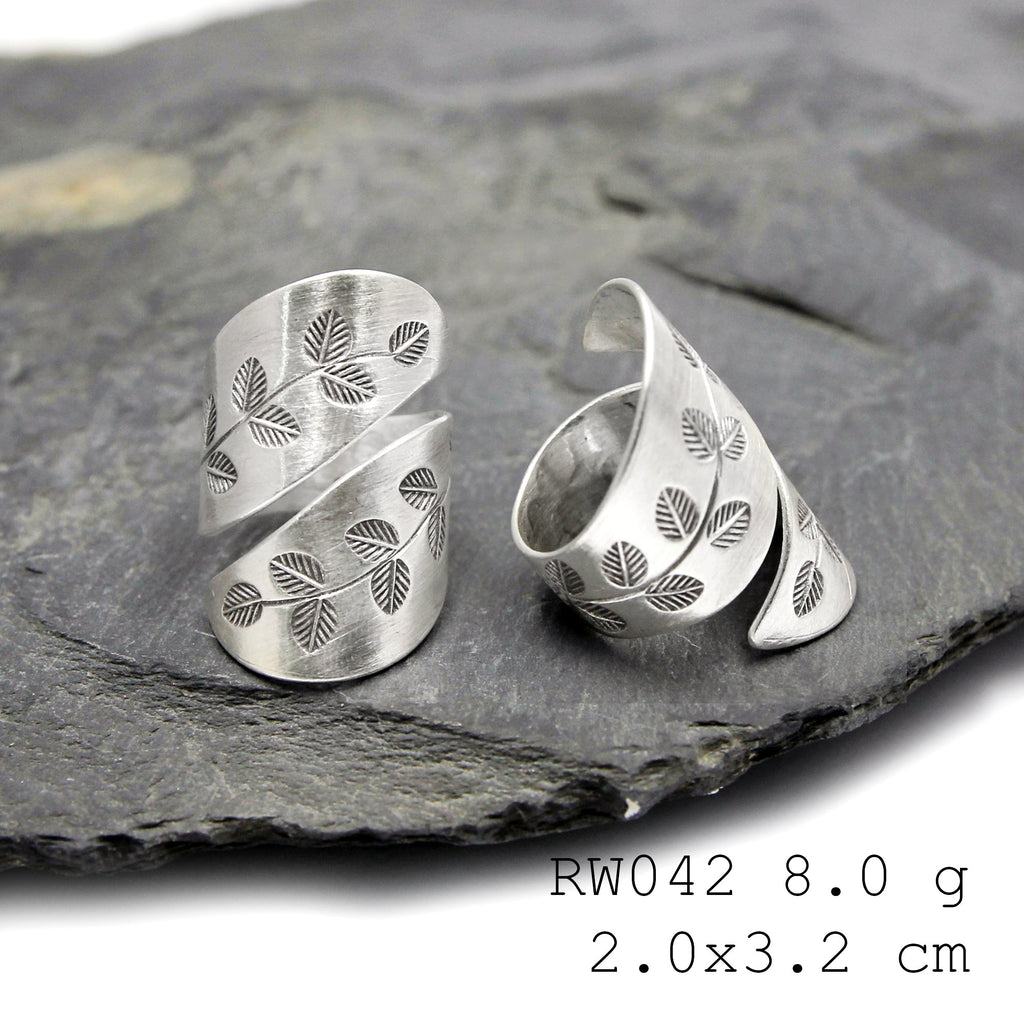 Fine silver cross. A handmade silver ring.