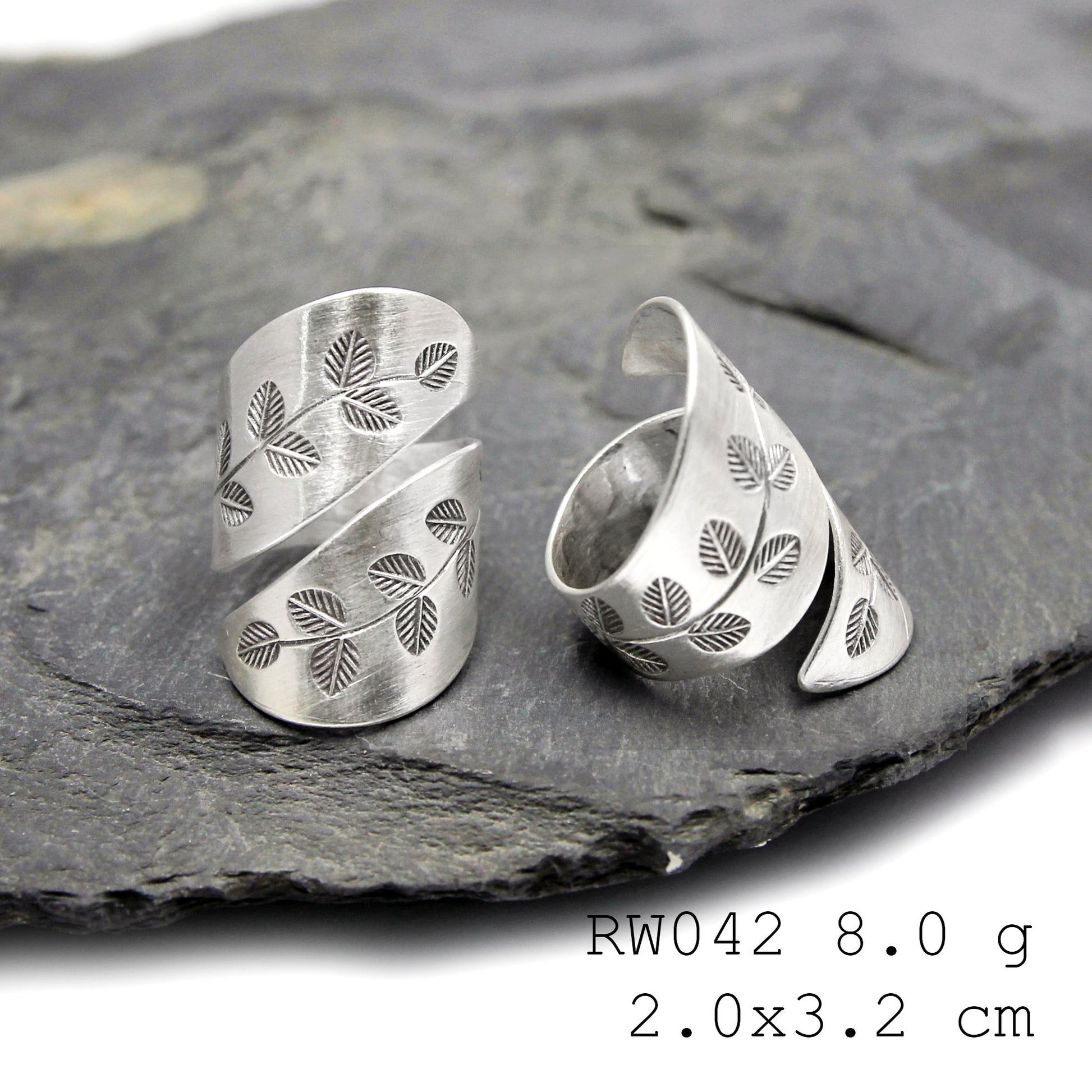 Fine silver cross. A handmade silver ring.