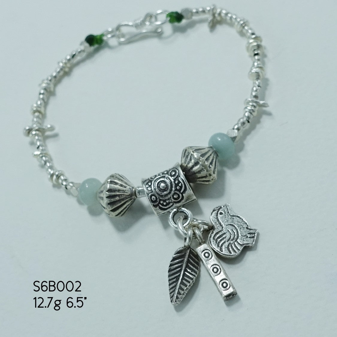 Elevate your style with our stunning silver bracelet.