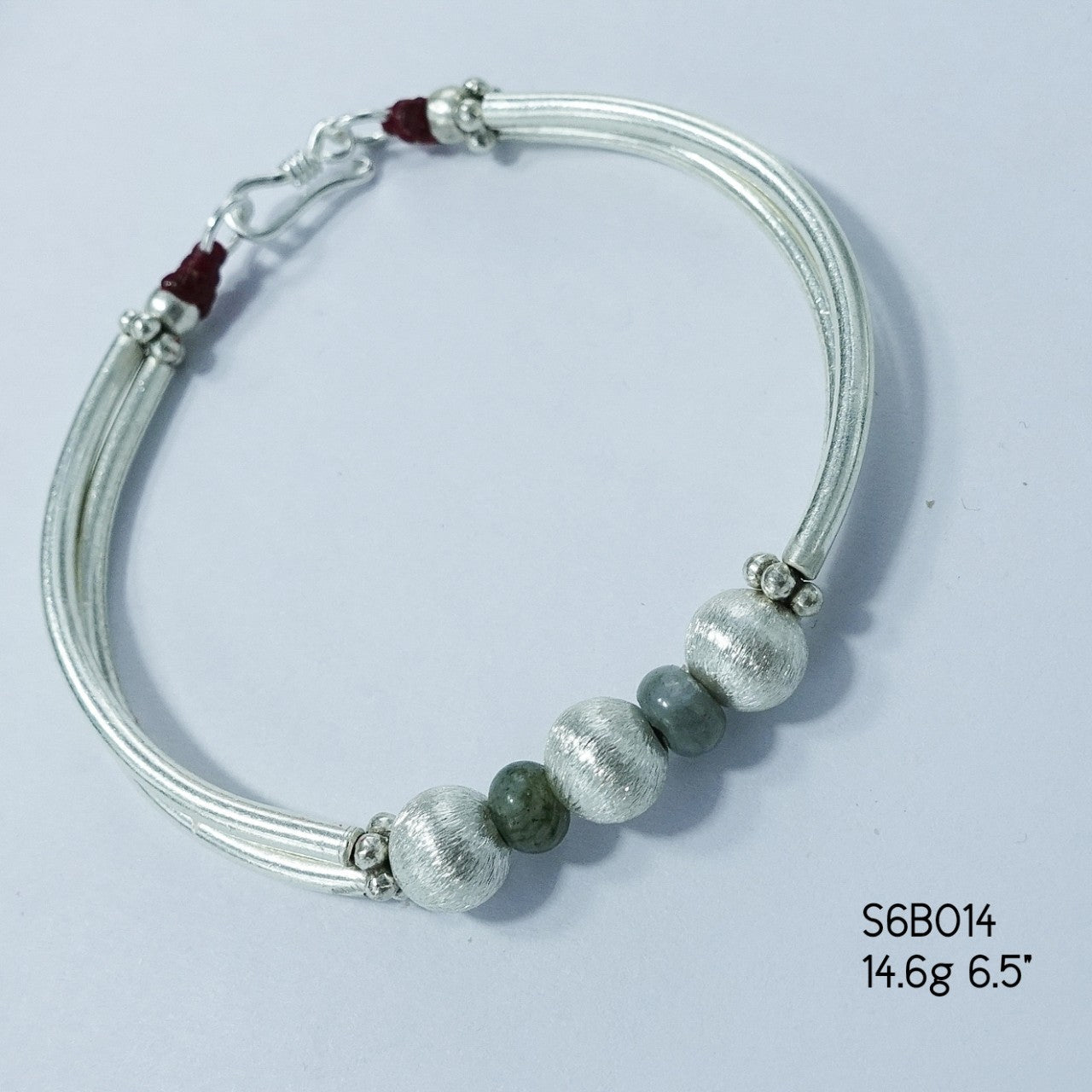 Wrap your wrist in elegance with this handcrafted silver bracelet.