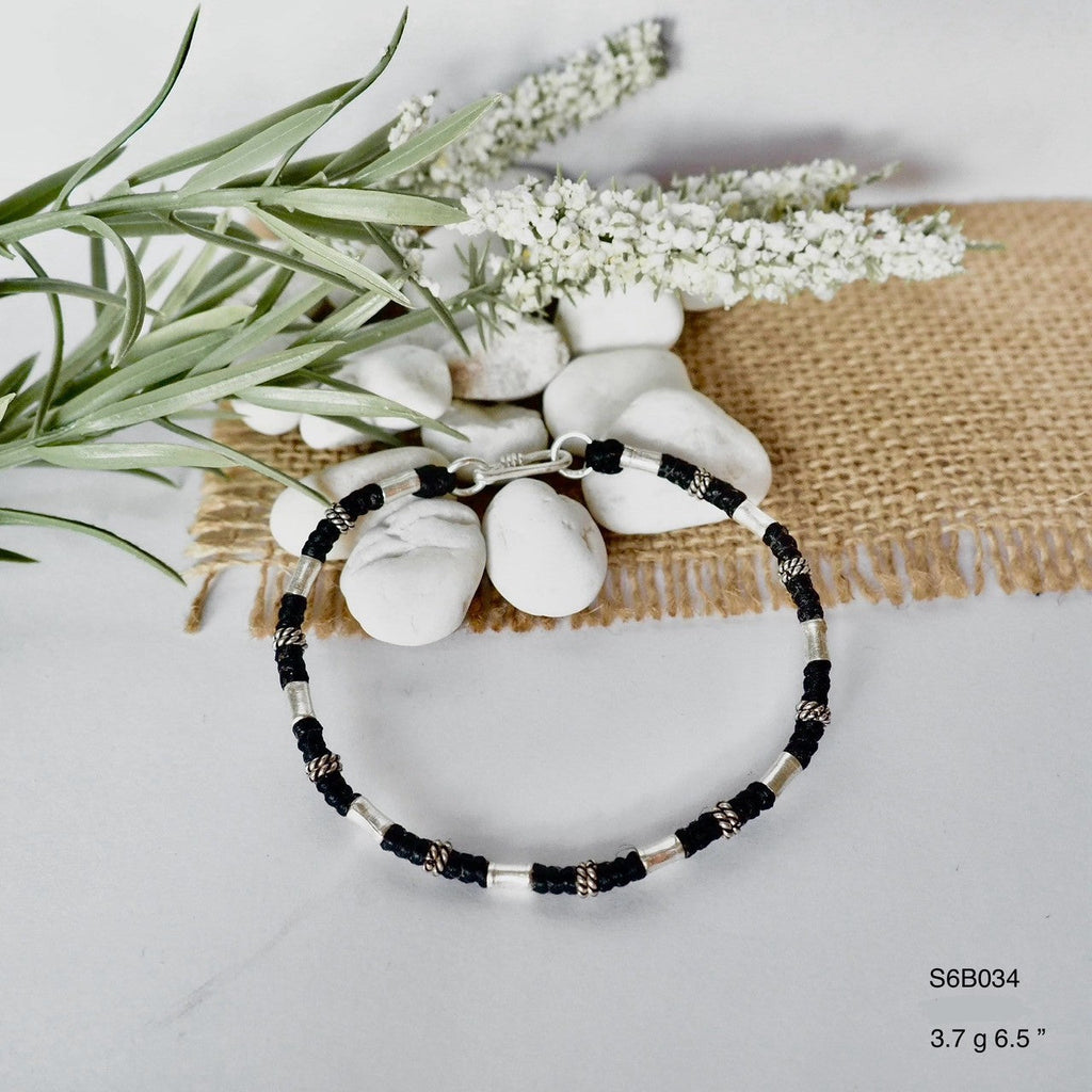 Make a statement with this unique silver bracelet.