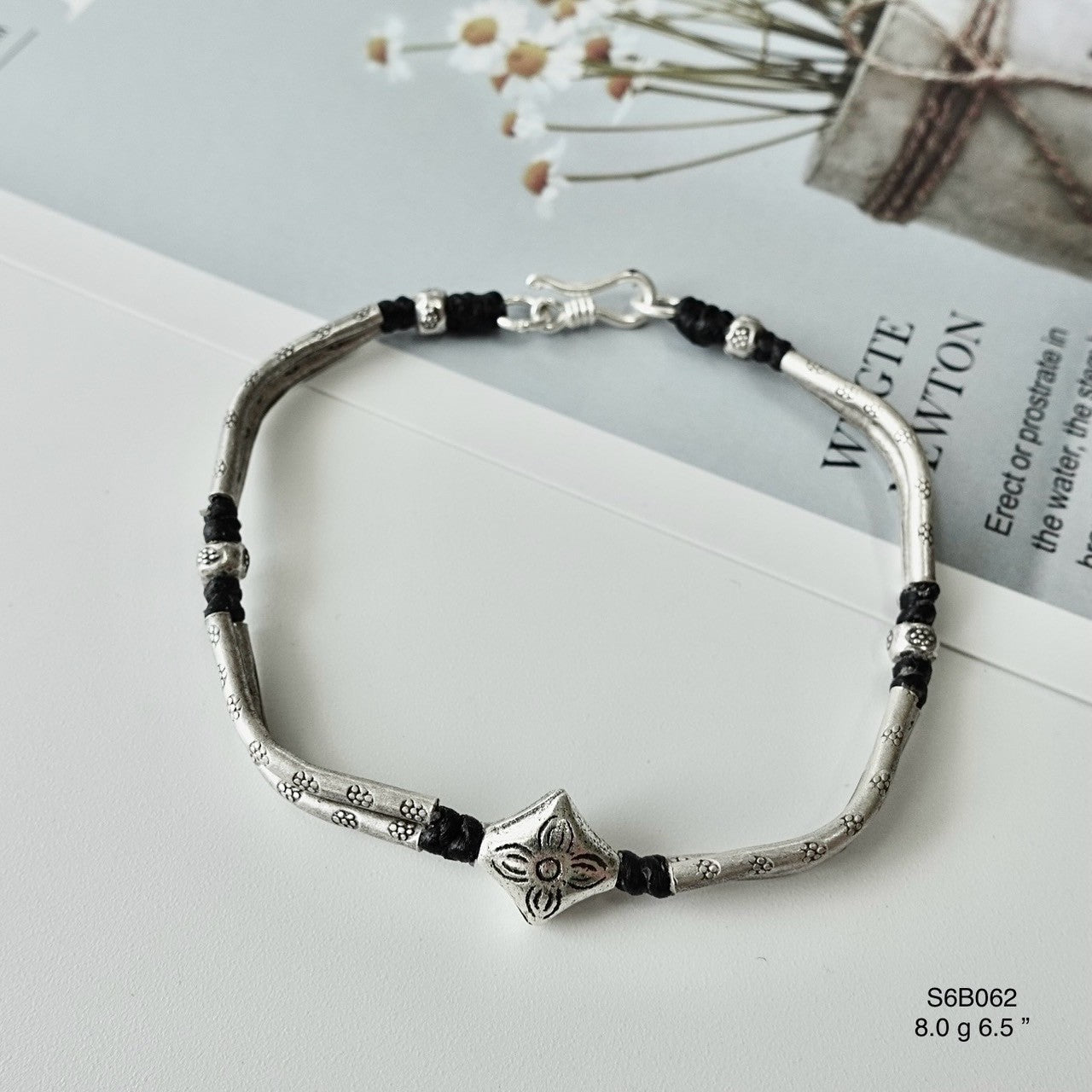 Fall in love with this detailed silver bracelet.