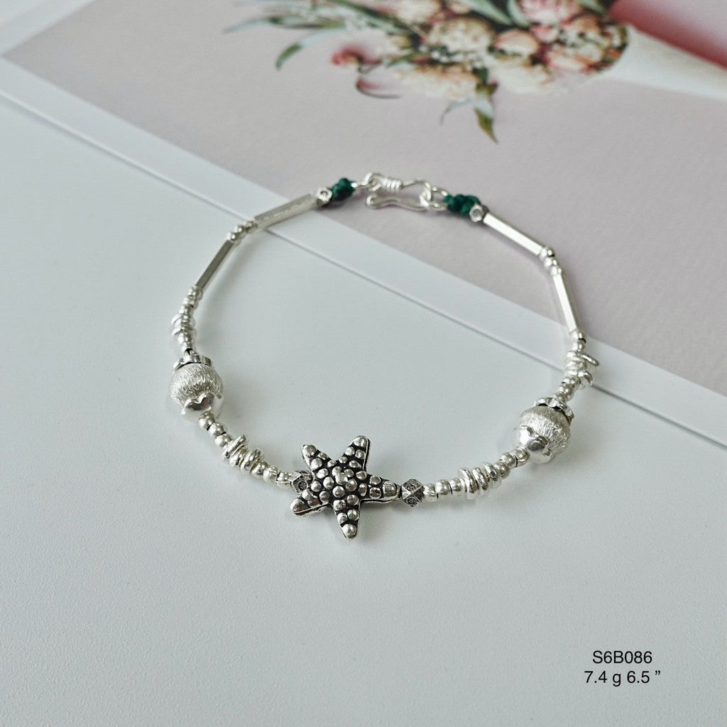 Handmade charm on this gorgeous bracelet.