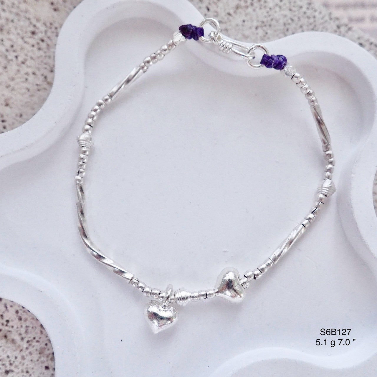 Catch the light with this sparkling silver bracelet.