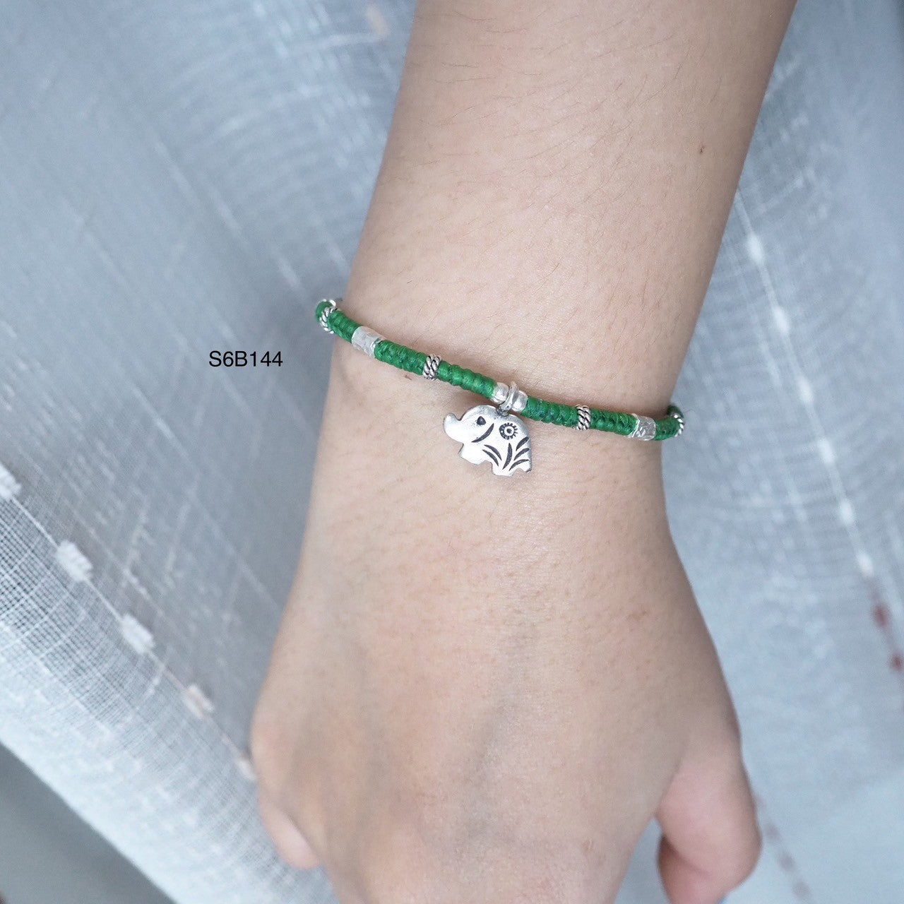 The detail on this silver bracelet is pure artistry.