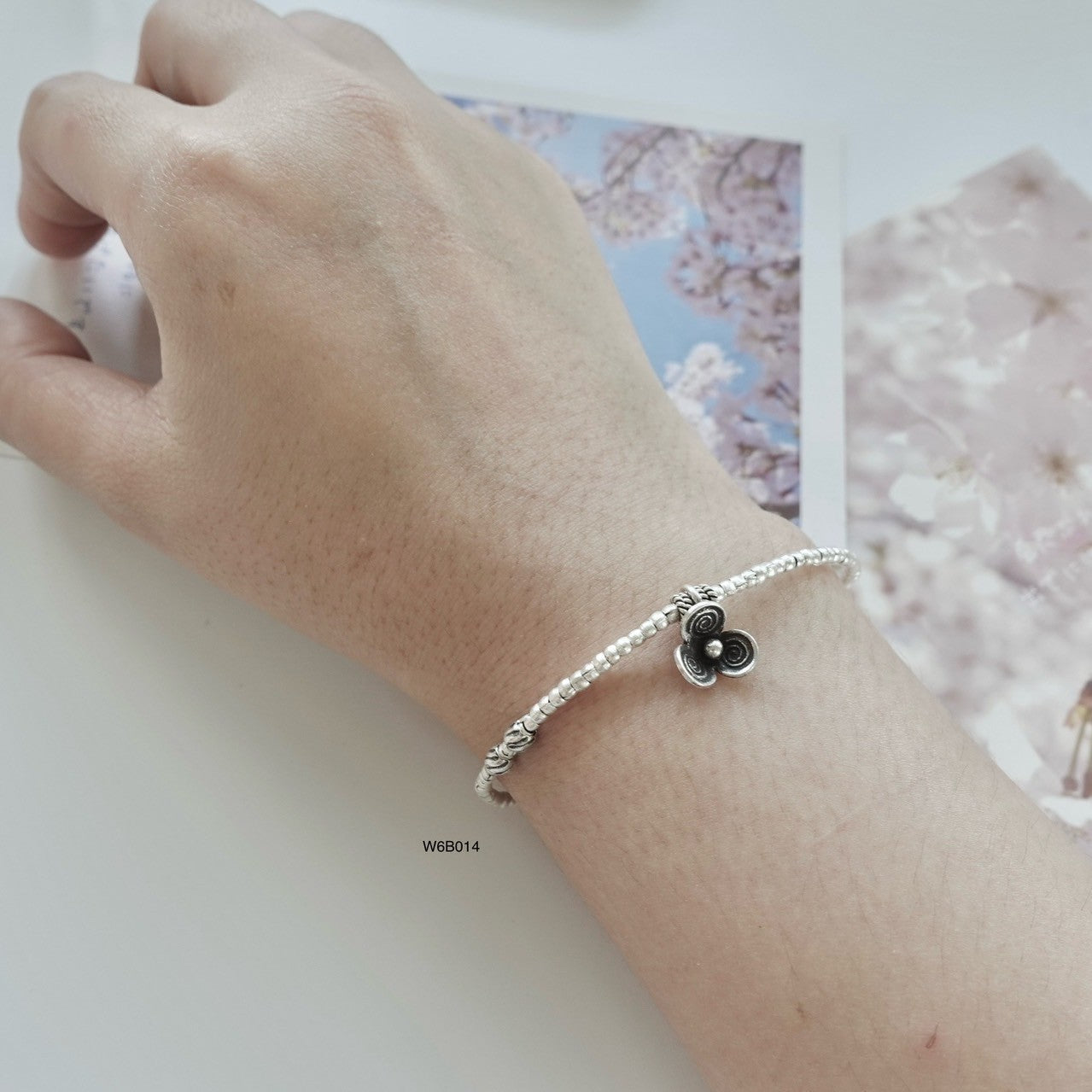 Grace your wrist with a silver bracelet, now on limited-time offer.