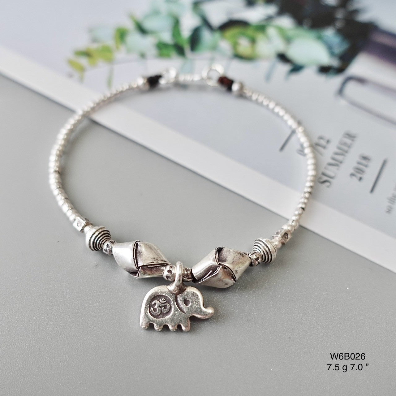 A silver bracelet that speaks luxury — now whispering a lower price.