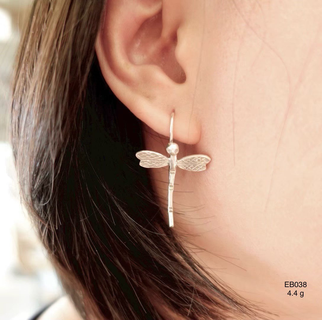Minimalist silver earrings.