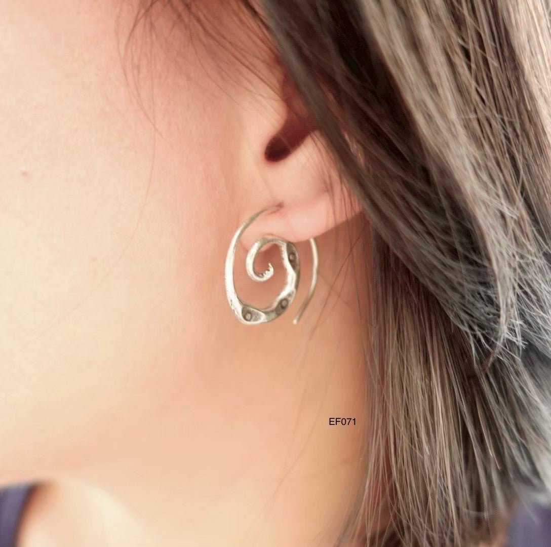 Elevate your look with pure silver earrings.