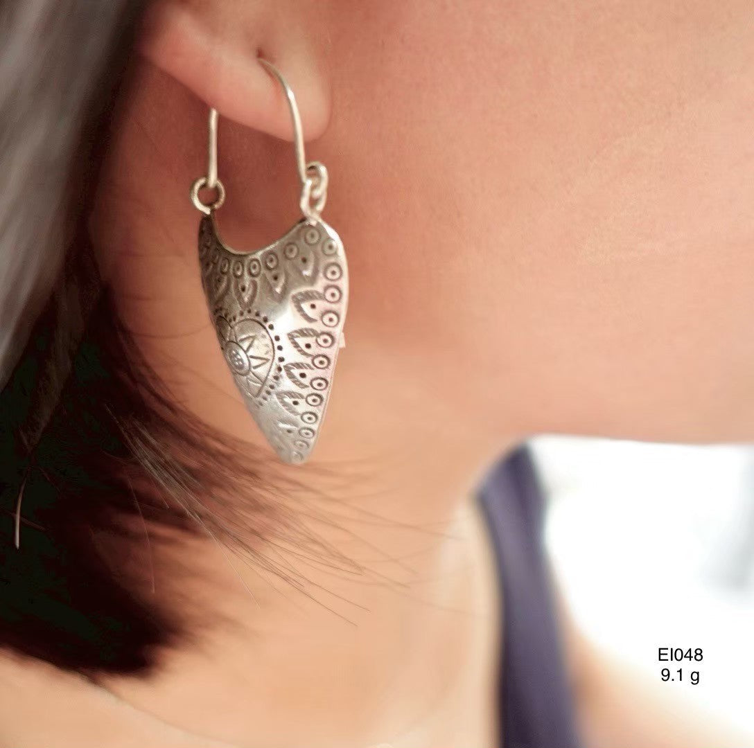 Catching the light. Handmade silver earrings.
